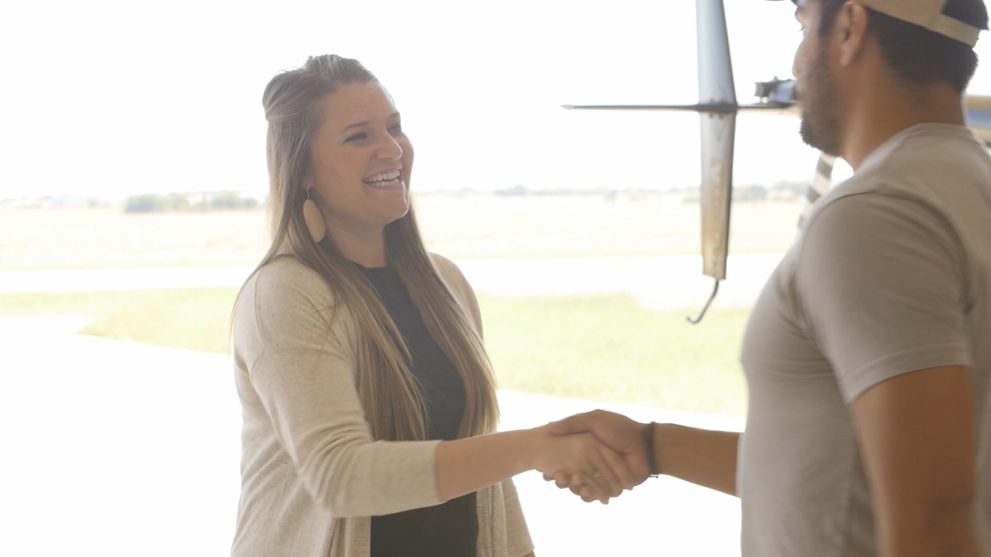 Happy woman shaking hands